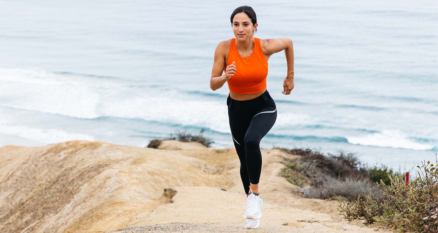 woman running up hill outside