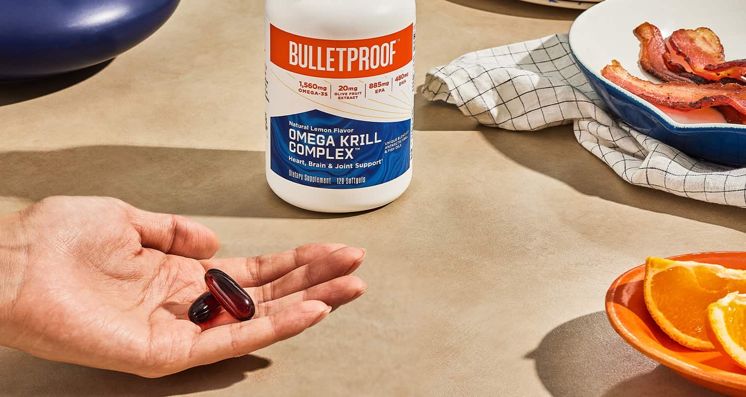 hand holding fish oil pills