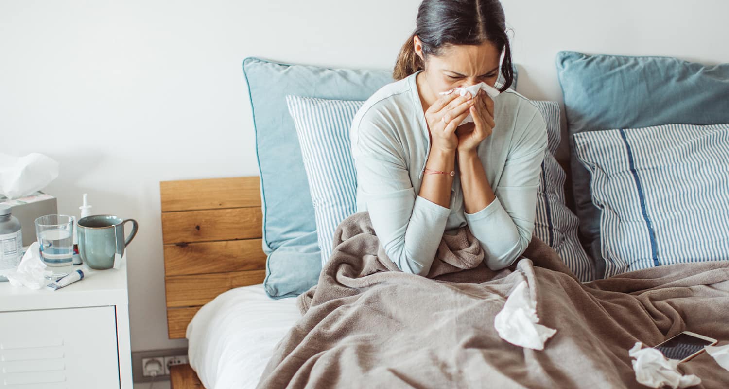 woman sick in bed