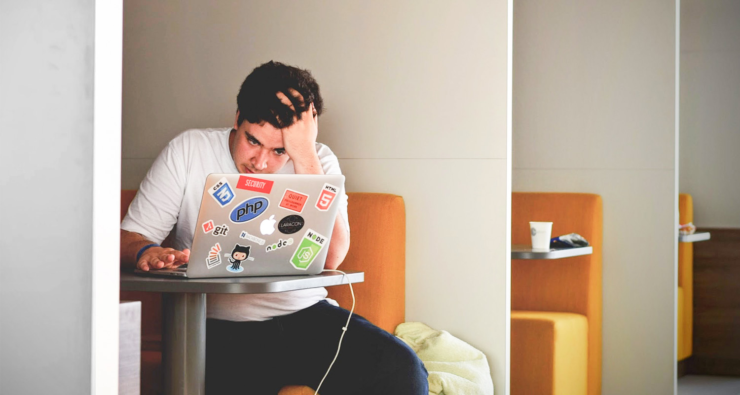 stressed out man at laptop