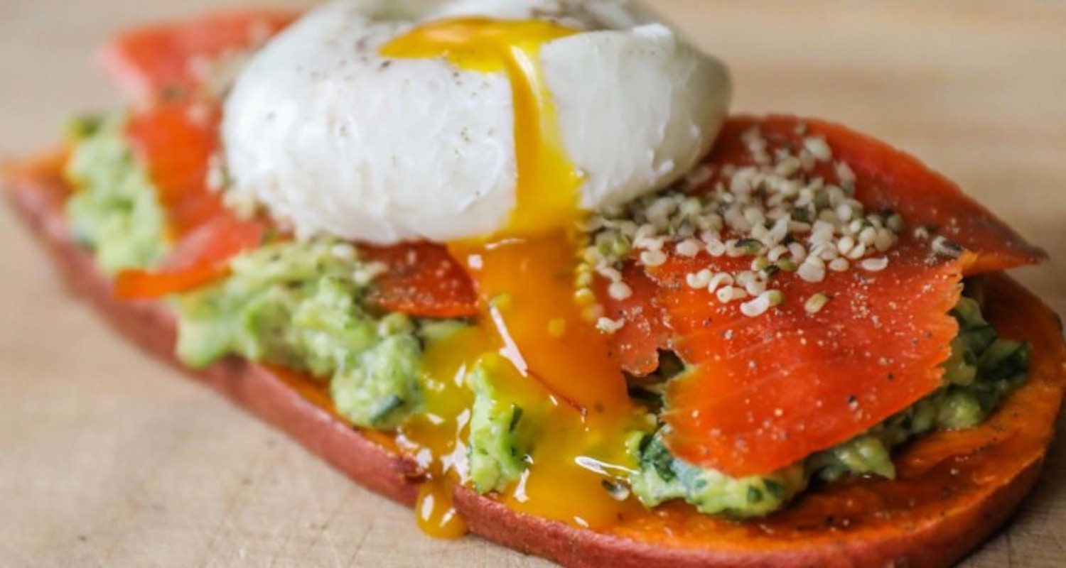 Salmon avocado toast with a runny egg