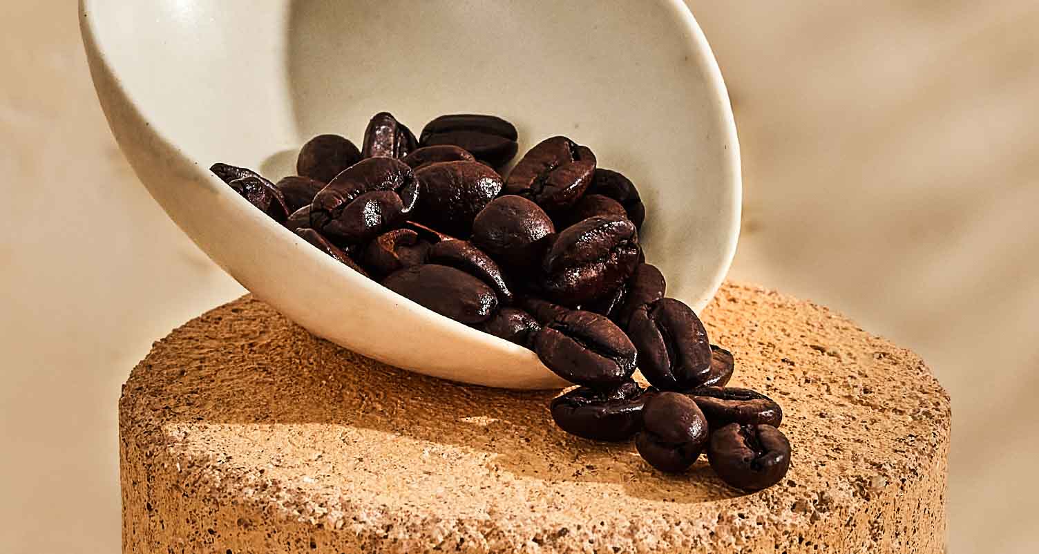 a scoop of coffee beans