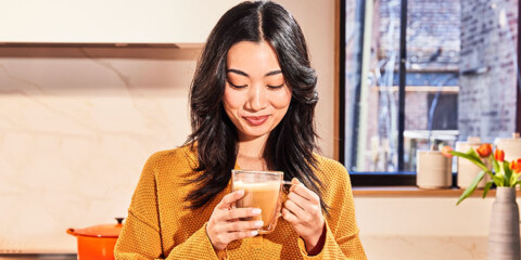 women enjoying a cup of coffee in a clear cup