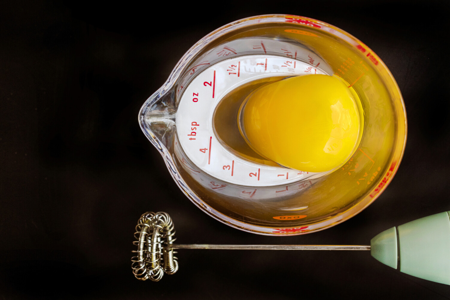 egg yolk in measuring cup