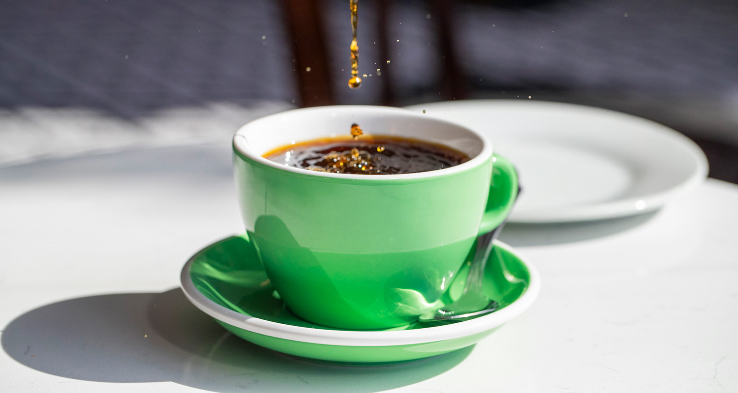 black coffee in a green cup