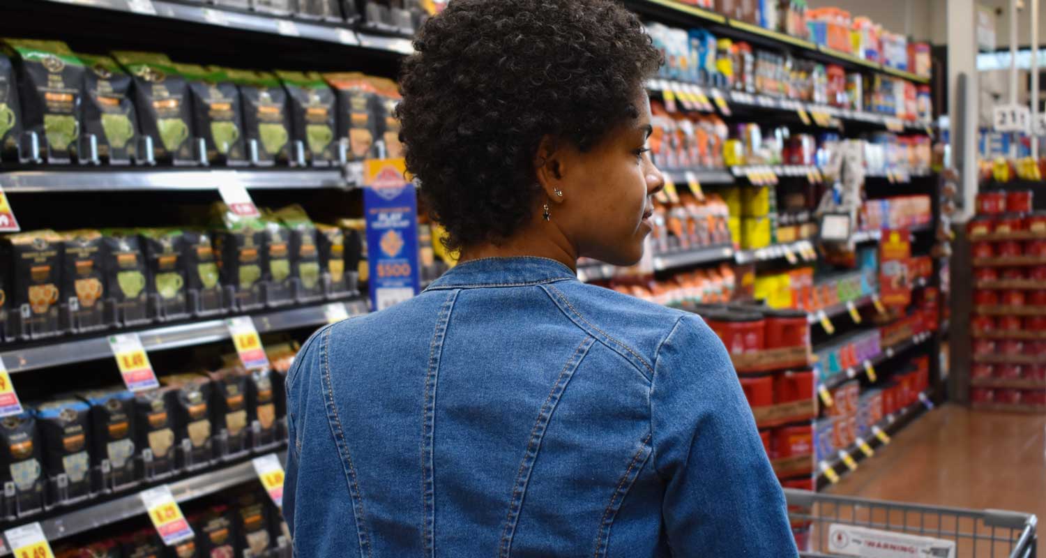 woman shopping the coffee aisle