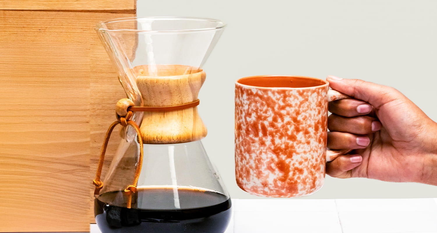 hand holding cup of coffee