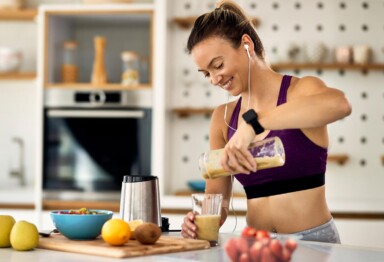 person eating healthy or having a shake after a workout/hike