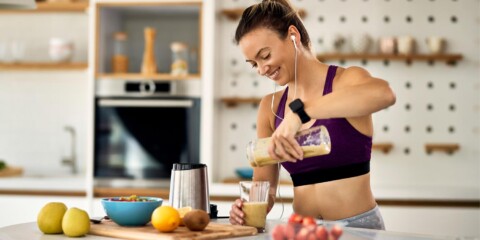 person eating healthy or having a shake after a workout/hike