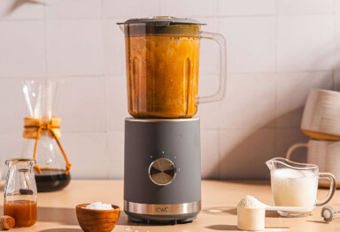 person making a blended coffee drink