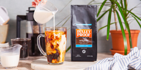 milk pouring into cold brew coffee