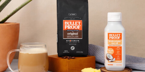 Bulletproof Original Ground Coffee bag, bottle of Brain Octane C8 MCT oil and mug of coffee on kitchen counter with scoop of ghee