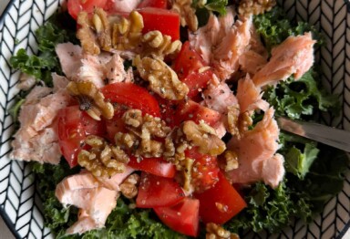 Insulin resistance diet salad with salmon, kale, tomatoes, and walnuts — a low-carb, high-protein meal for blood sugar balance.
