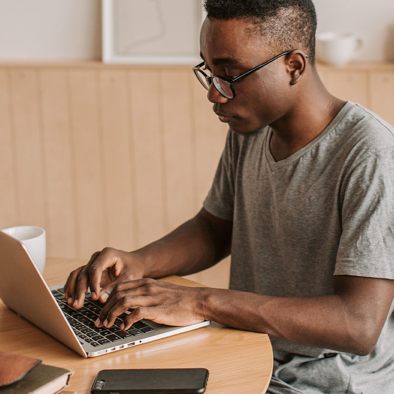 Man typing on laptop