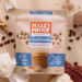 Bulletproof mushroom latte packaging next to scoop of coffee, coffee beans, and functional mushrooms
